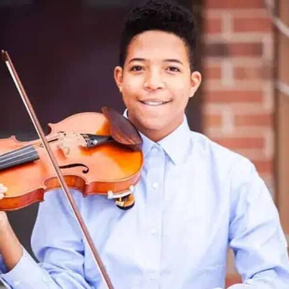 Connections Academy student Leon with his violin. 